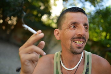 latino man smoke cigarettes
