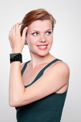 Girl with a modern Internet Smart Watch on grey background