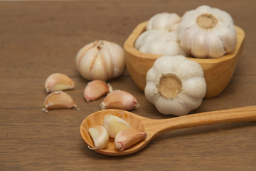 Garlic in wooden spoon