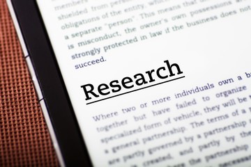 Obraz premium Research on tablet screen, ebook concept