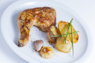 crispy chicken leg with baked potatos