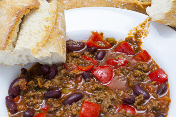 delicious home made chili con carne with bread and sour cream