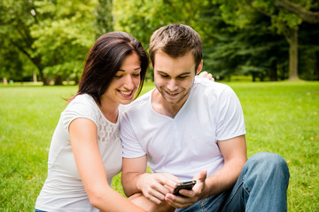 Young couple with smartphone