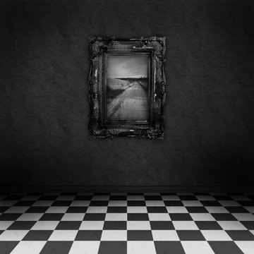 Empty dark room with black&white checker floor painting on wall