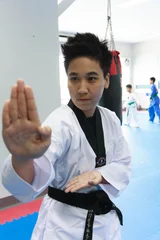 Papier Peint photo Arts martiaux Taekwondo player in pose