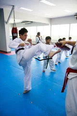 Foto auf Acrylglas Kampfkunst Taekwondo kick class