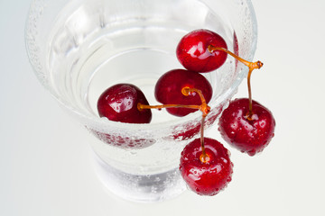 glass with water as cherries