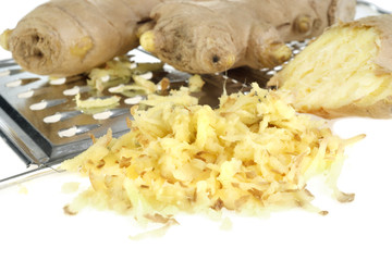 Ginger and kitchen grater isolated on white background