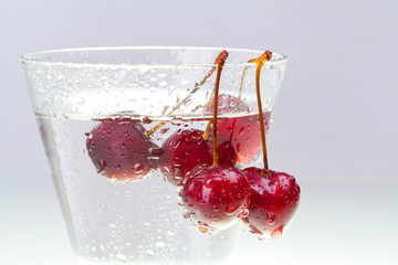 glass with water and cherries