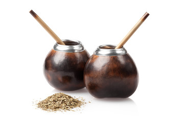 two calabashes with yerba mate isolated on white background