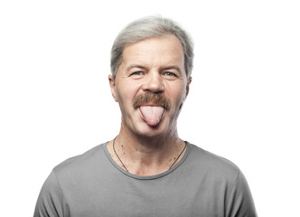 funny mature man shows tongue isolated on white background