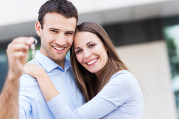 Couple with keys to new home