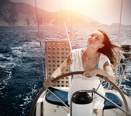 Woman behind the wheel yacht