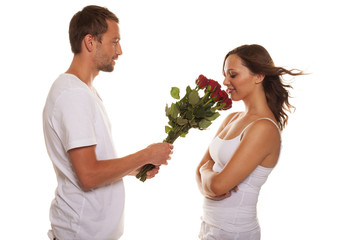 Husband offering a rose to his happy wife