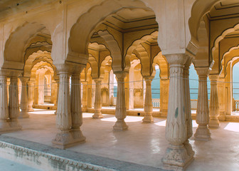 Gallery of rimmed pillars in light sunshine at Jaipur's Amber Fo