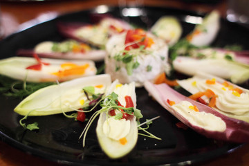 Cheese and vegetables on a tray.