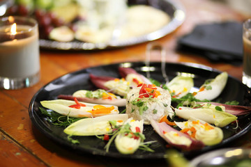 Cheese and vegetables on a tray.