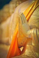Hand of Buddha statue which praying