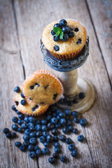 Obraz na płótnie Canvas Homemade blueberry muffins in paper cupcake holder