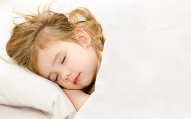 Fototapeta premium Little girl sleep in the bed