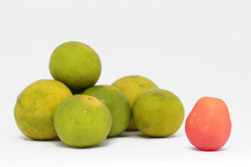 Lemon fruit with one Cherry tomatoes.