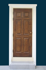 Brown wood door with dark green wall