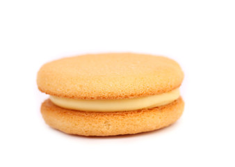 Biscuit sandwich with white filling. Close up.