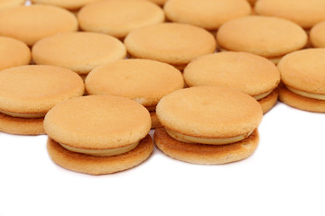 Biscuit sandwich with white filling.