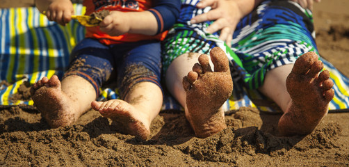 Bare feet and Sand at the Beach.