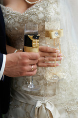 Bride and groom with glasses of champagne