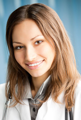 Cheerful female doctor at office