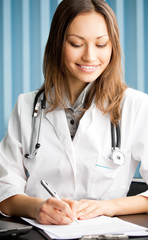 Writing doctor at office