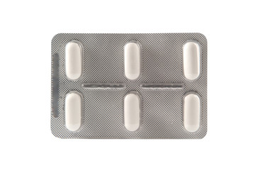 Closed up long white tablet in transparent blister pack