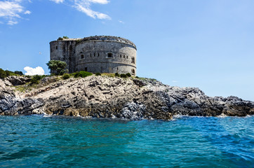 Sea view and old tower on the island in Kotor bay, Montenegro.