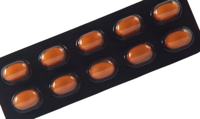 Closed up soft capsule in brown transparent blister pack