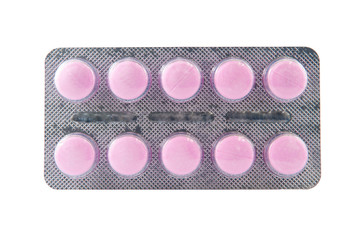 Closed up pink tablet in blister pack show medicine texture back
