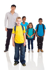 boy standing in front of classmates and teacher