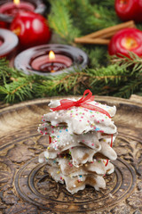 Christmas gingerbread cookies in star shape on wooden tray