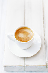 espresso coffee in white cup on old rustic  style table