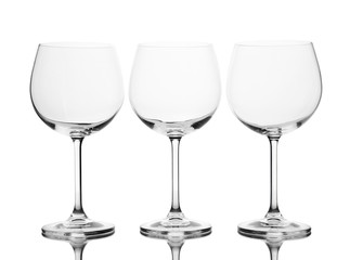 Empty wine glasses arranged and isolated on white