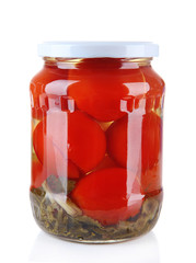 Tasty canned tomatoes in glass jar, isolated on white