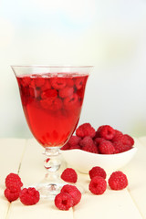 Jelly with fresh berries on wooden table