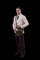 young urban man taking camera from bag