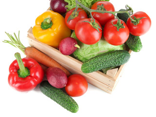Fresh vegetables in wooden box on grey background