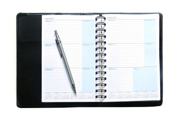notebook and pen on white background