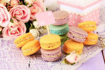 Macaroons on wooden table close-up