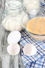 Ingredients for dough on wooden table close-up