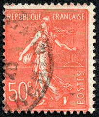 stamp printed in France shows sowing woman