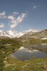 Fototapeta na wymiar Zinalrothorn reflected in Leisee lake in Swiss Alps
