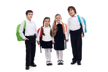Group of children holding hands going back to school